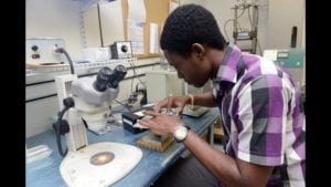 Yaw Opoku-Agyeman assembles a devices used for identifying early stage cancer cells.